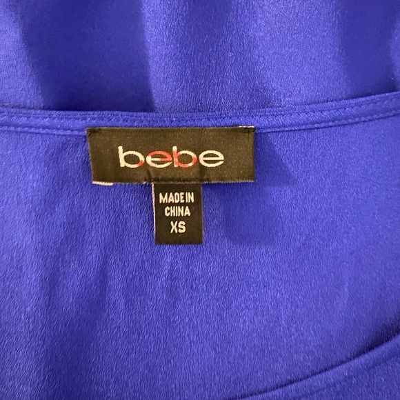 “BEBE” Brielle Bell Sleeve Asymmetrical Blouse - Picture 10 of 12